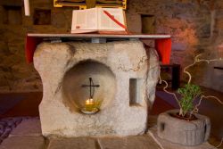 stone altar in the small chapel, the first church at Bose